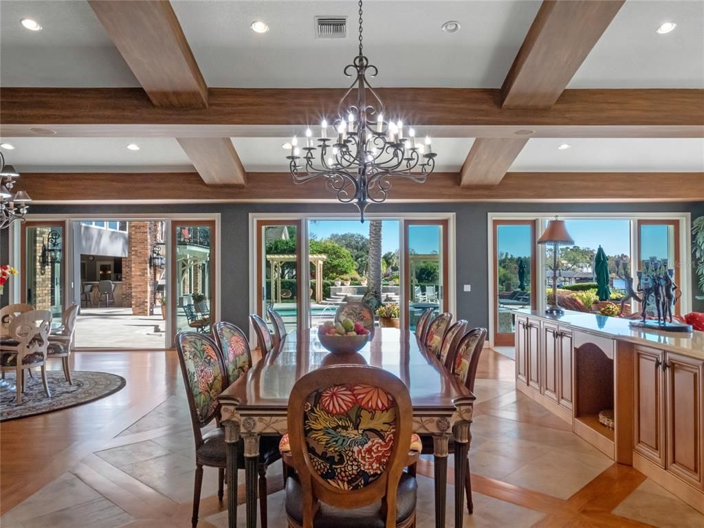 Chandelier, Dining room, Fireplace, Interior, Recessed Lighting, Stone Walls, Wooden Beams, Wood Texture Flooring