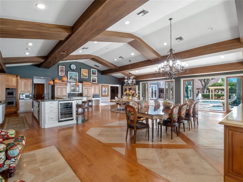 Chandelier, Dining room, Interior, Kitchen, Pendant Lights, Recessed Lighting, Stainless Steel Appliances, Wooden Beams, Wood Texture Flooring