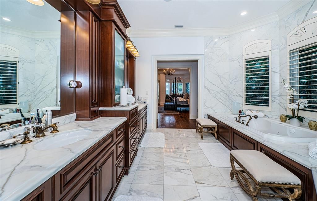 Bathroom, Dual Sink Vanities, Interior, Marble, Marble Walls, Recessed Lighting, Wood Texture Flooring