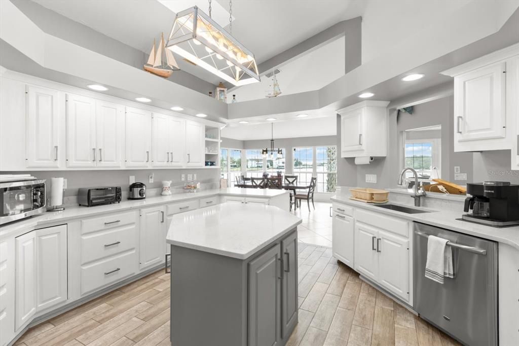 Chandelier, Dining room, Interior, Kitchen, Pendant Lights, Recessed Lighting, Stainless Steel Appliances, Wood Texture Flooring