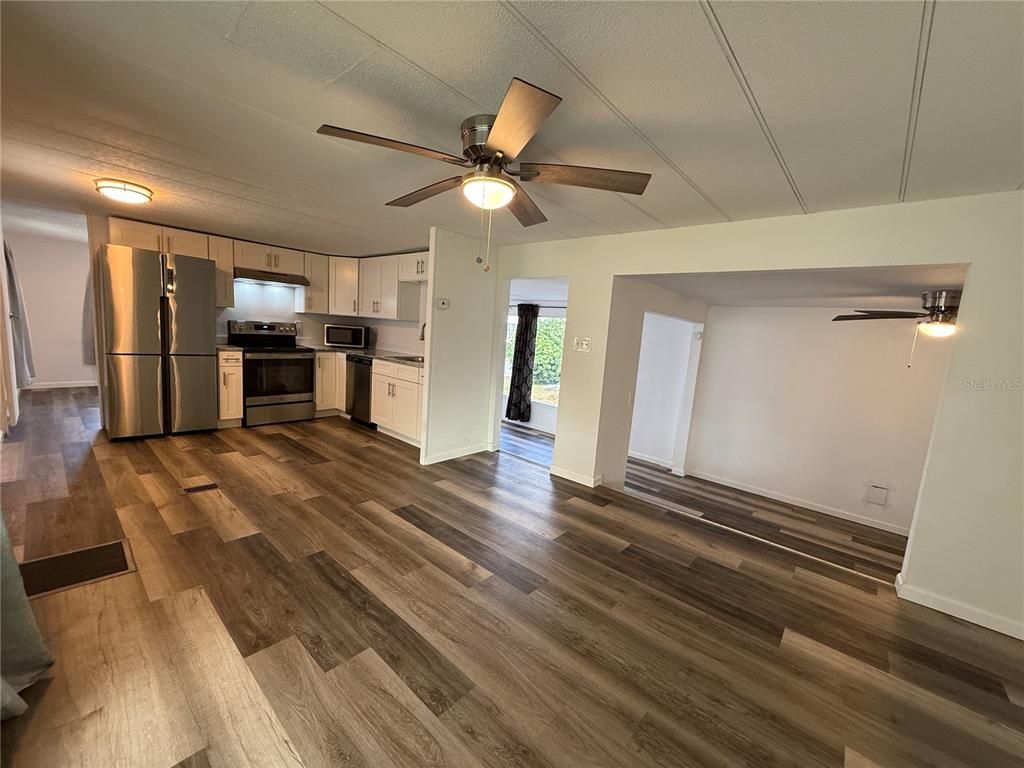 Empty room, Interior, Kitchen, Stainless Steel Appliances, Wood Texture Flooring