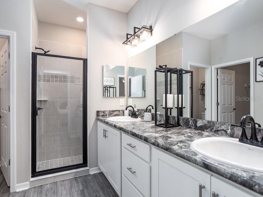 Bathroom, Dual Sink Vanities, Glass Shower, Interior, Recessed Lighting, Wood Texture Flooring
