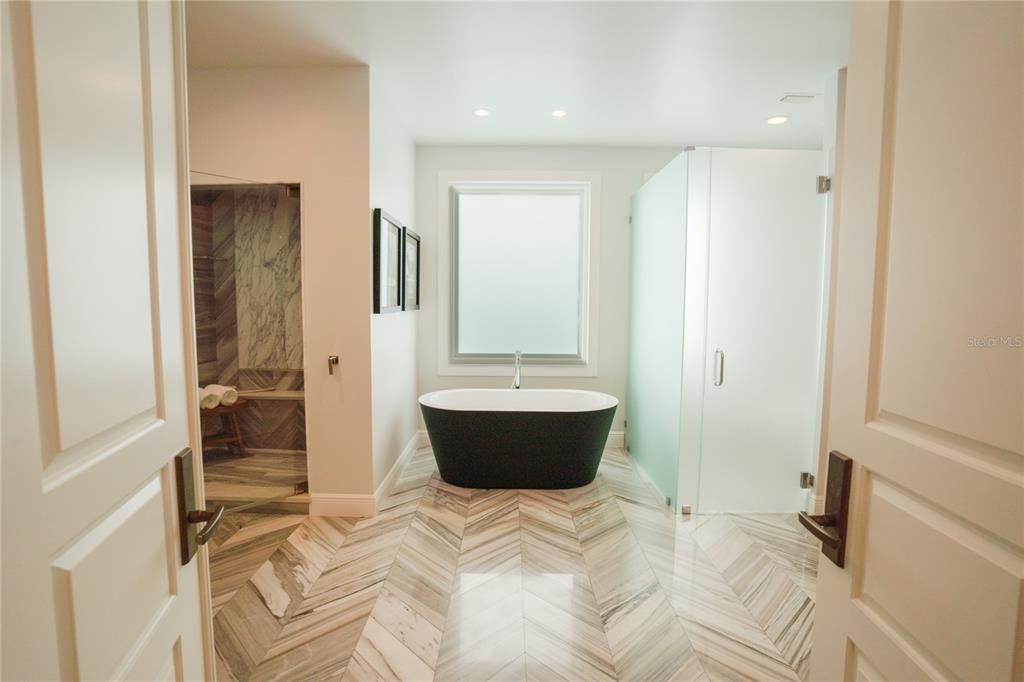 Bathroom, Free Standing Baths, Glass Shower, Interior, Recessed Lighting, Wood Texture Flooring