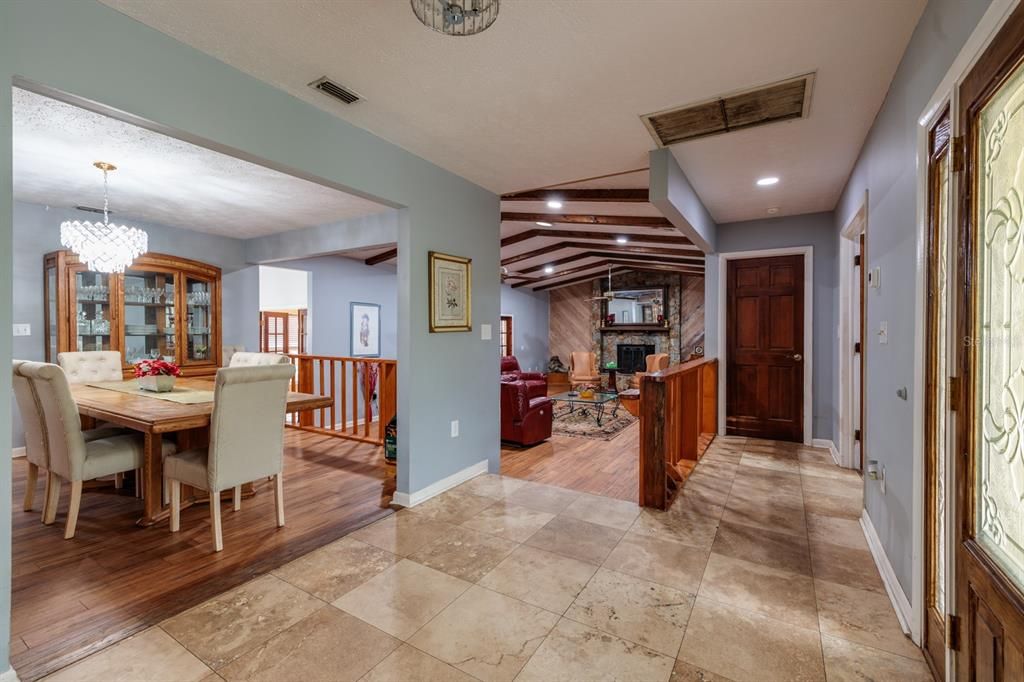 Chandelier, Dining room, Fireplace, Interior, Living room, Recessed Lighting, Wooden Beams, Wood Texture Flooring
