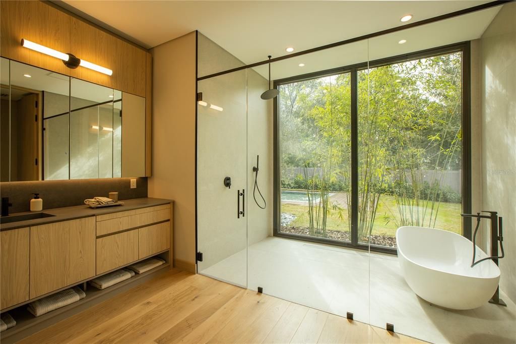 Bathroom, Free Standing Baths, Glass Shower, Interior, Recessed Lighting, Wood Texture Flooring