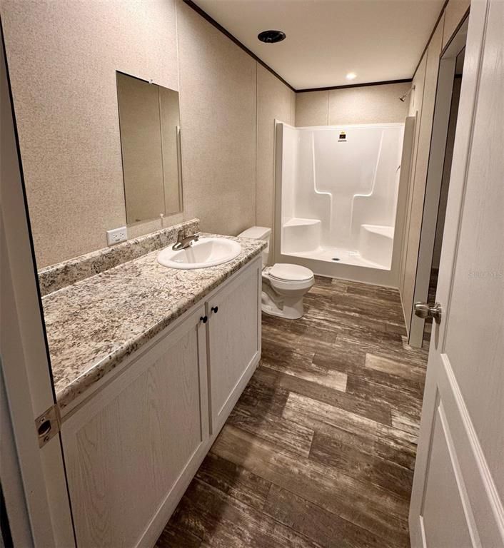 Bathroom, Dual Sink Vanities, Interior, Recessed Lighting, Wood Texture Flooring