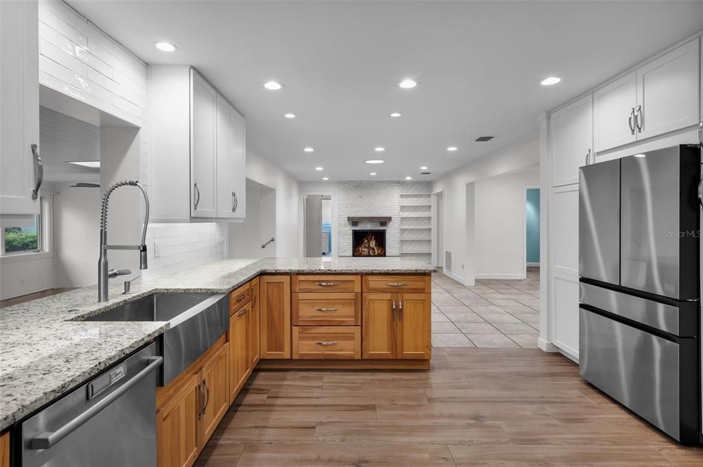 Fireplace, Interior, Kitchen, Recessed Lighting, Stainless Steel Appliances, Wood Texture Flooring