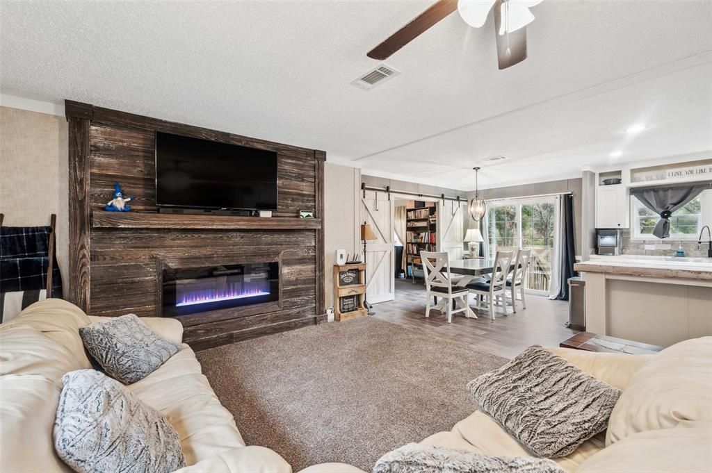 Dining room, Fireplace, Interior, Kitchen, Living room, Pendant Lights, Recessed Lighting, Wood Texture Flooring