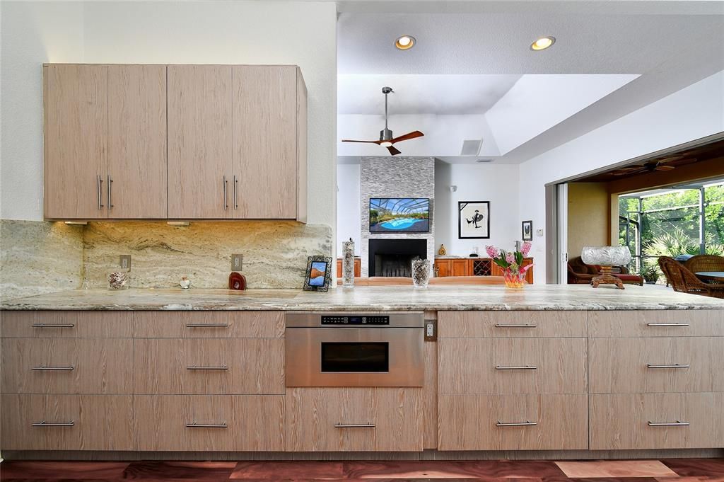 Fireplace, Interior, Kitchen, Recessed Lighting, Stainless Steel Appliances, Stone Walls, Wood Texture Flooring