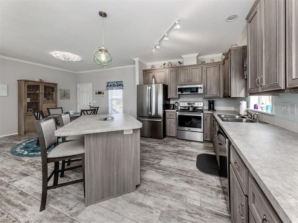 Dining room, Interior, Kitchen, Pendant Lights, Stainless Steel Appliances, Wood Texture Flooring