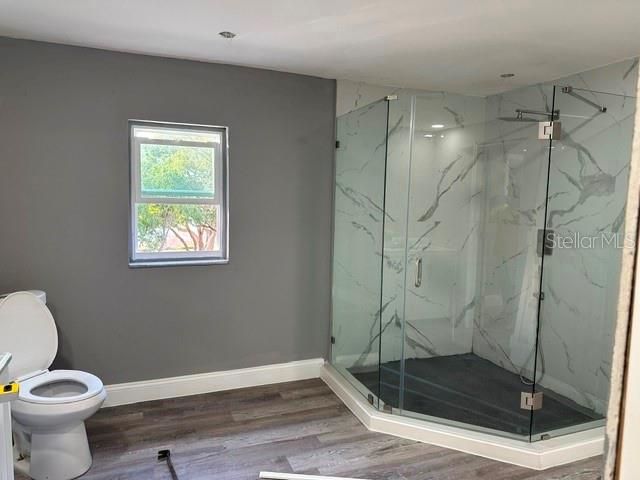 Bathroom, Glass Shower, Interior, Marble Walls, Wood Texture Flooring