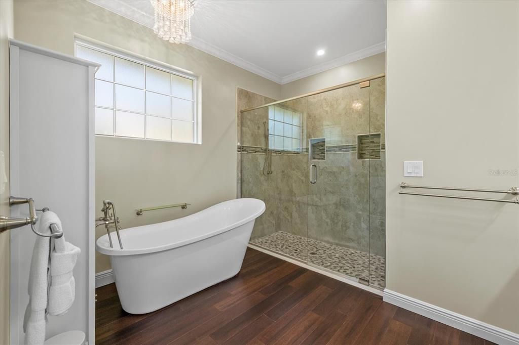 Bathroom, Chandelier, Free Standing Baths, Glass Shower, Interior, Recessed Lighting, Wood Texture Flooring