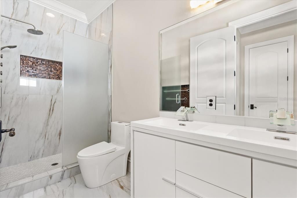 Bathroom, Dual Sink Vanities, Interior, Marble, Marble Walls, Recessed Lighting