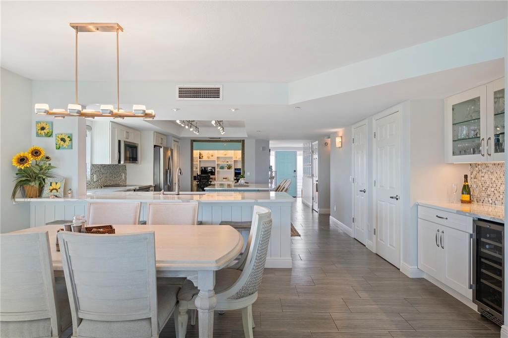 Dining room, Interior, Kitchen, Pendant Lights, Recessed Lighting, Stainless Steel Appliances, Wood Texture Flooring