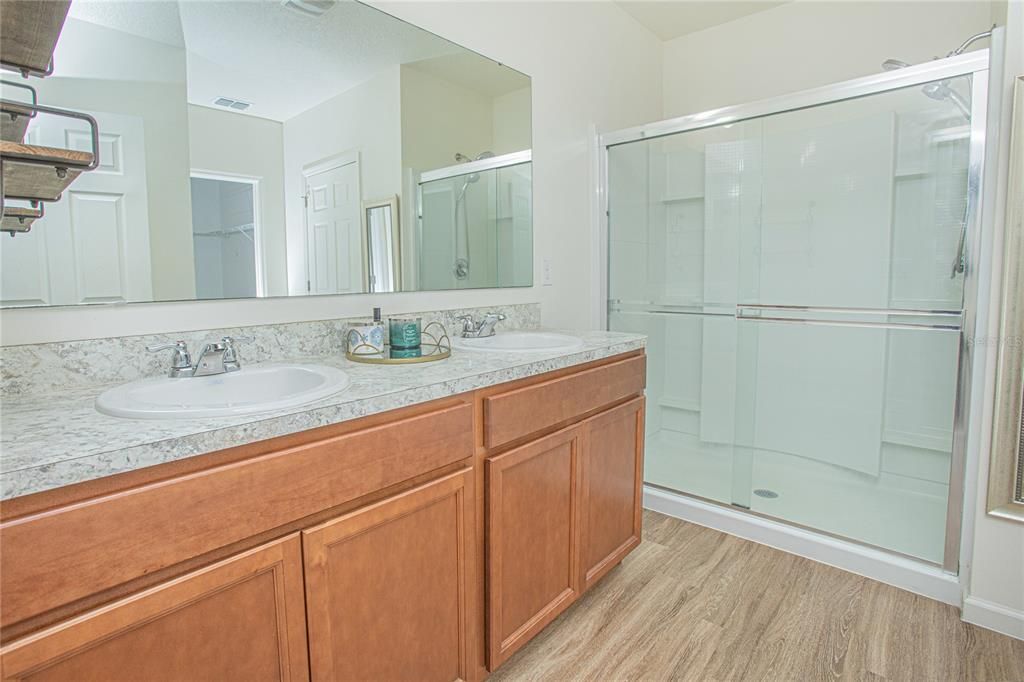 Bathroom, Dual Sink Vanities, Glass Shower, Interior, Tile Countertops, Wood Texture Flooring