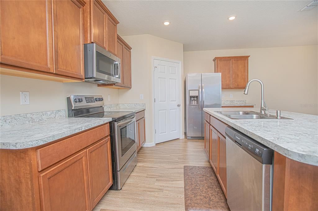 Interior, Kitchen, Recessed Lighting, Stainless Steel Appliances, Wood Texture Flooring