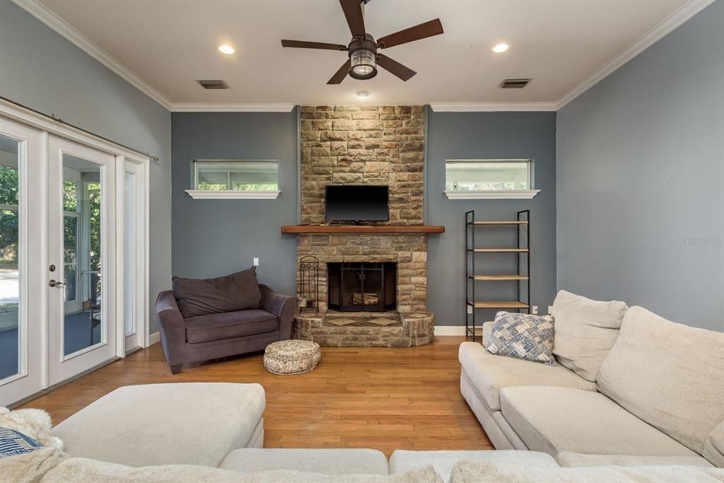 Fireplace, Interior, Living room, Recessed Lighting, Stone Walls, Wood Texture Flooring