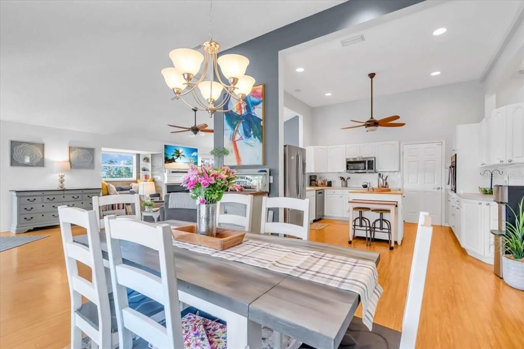 Chandelier, Dining room, Interior, Kitchen, Recessed Lighting, Tile Countertops, Wood Texture Flooring