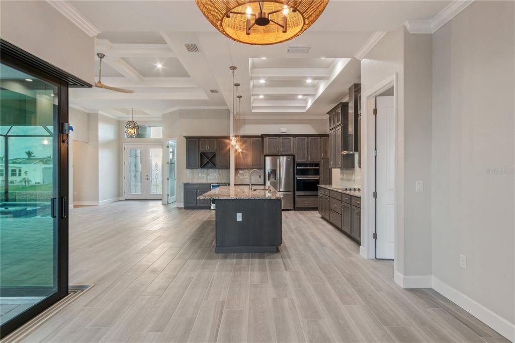 Chandelier, Interior, Kitchen, Pendant Lights, Recessed Lighting, Stainless Steel Appliances, Wood Texture Flooring