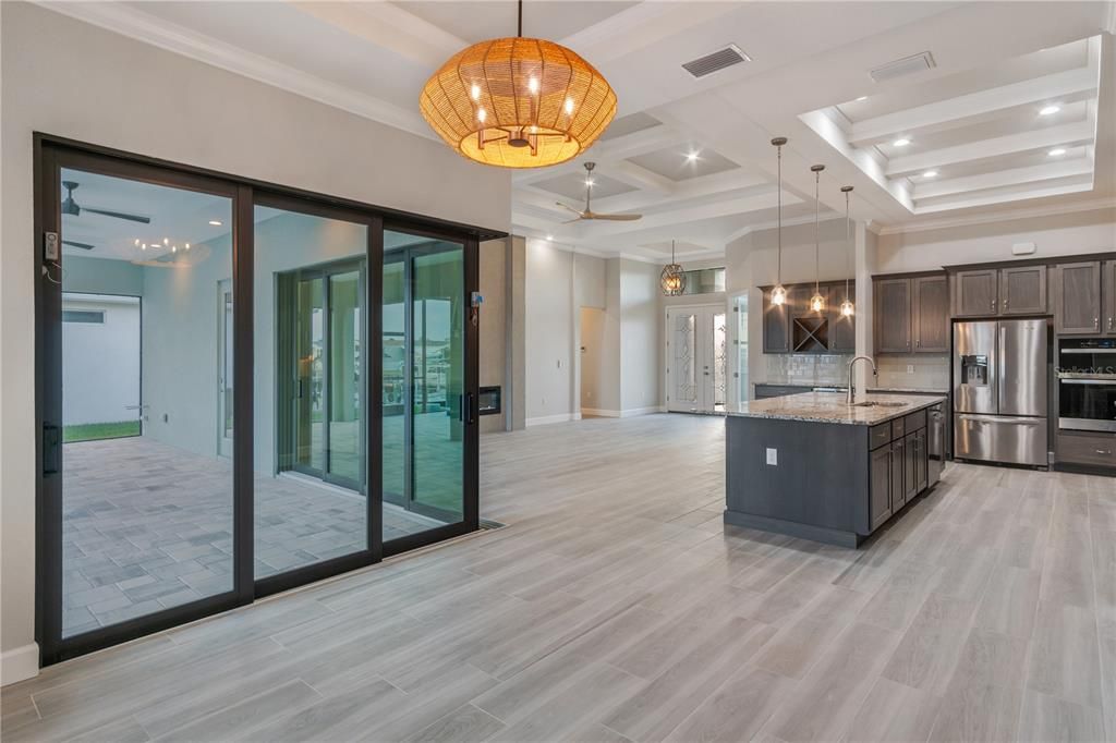 Chandelier, Interior, Kitchen, Pendant Lights, Recessed Lighting, Stainless Steel Appliances, Wood Texture Flooring