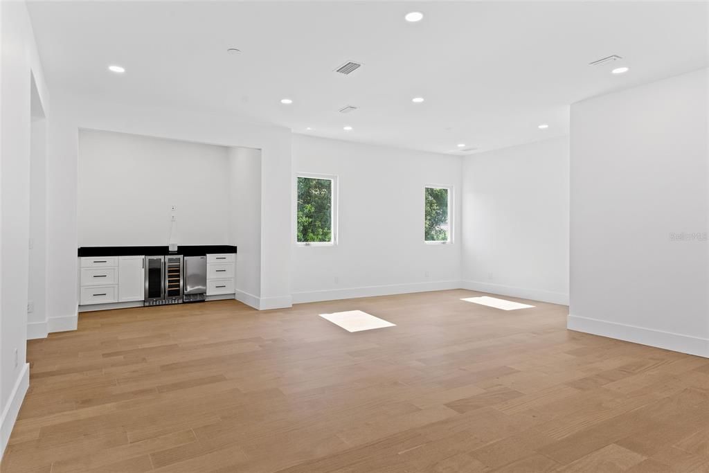 Empty room, Interior, Recessed Lighting, Stainless Steel Appliances, Wood Texture Flooring