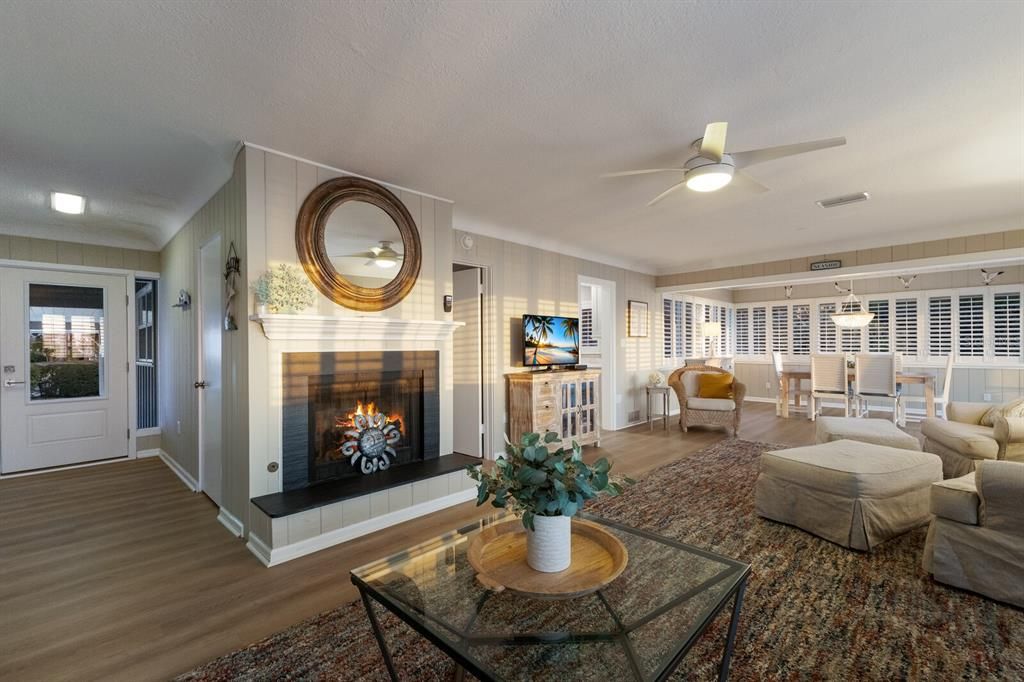 Dining room, Fireplace, Interior, Living room, Pendant Lights, Recessed Lighting, Wood Texture Flooring