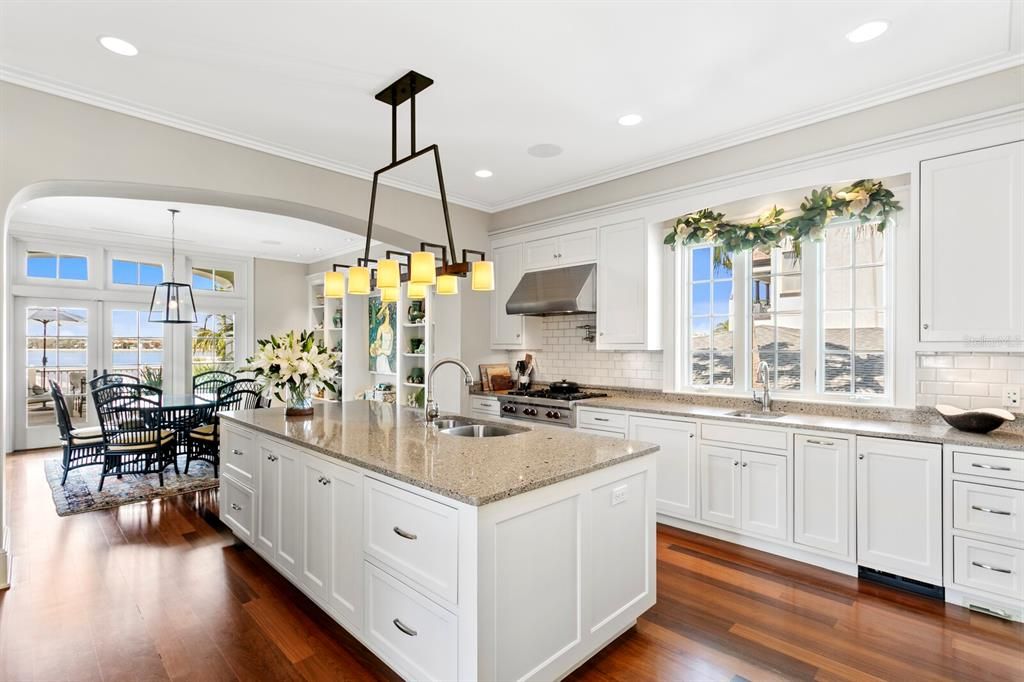 Chandelier, Dining room, Interior, Kitchen, Pendant Lights, Recessed Lighting, Stainless Steel Appliances, Wood Texture Flooring