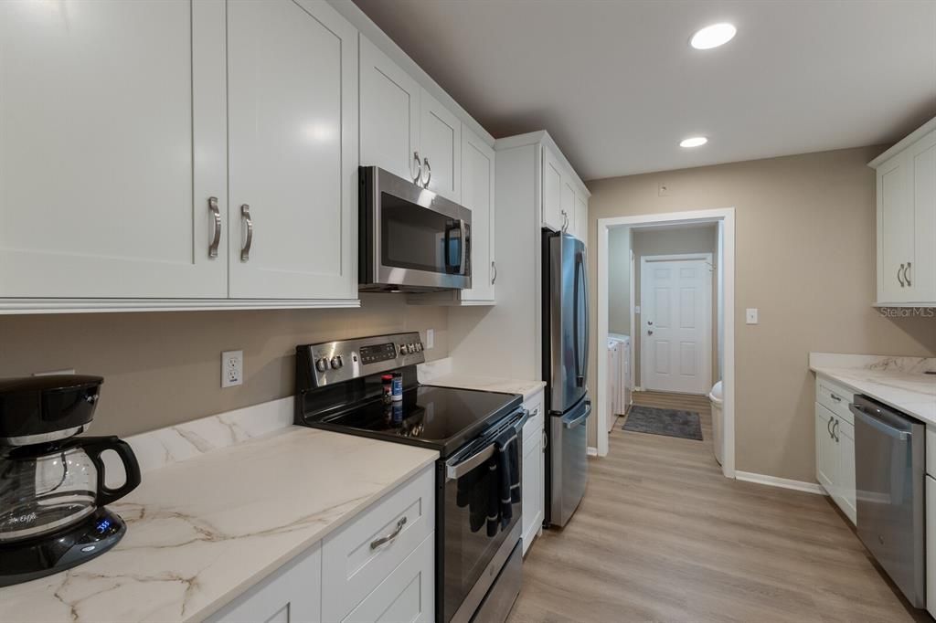 Interior, Kitchen, Recessed Lighting, Stainless Steel Appliances, Wood Texture Flooring