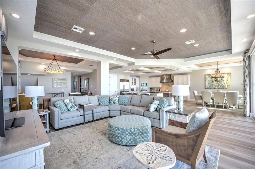 Chandelier, Dining room, Interior, Kitchen, Living room, Pendant Lights, Recessed Lighting, Stainless Steel Appliances, Wood Texture Flooring