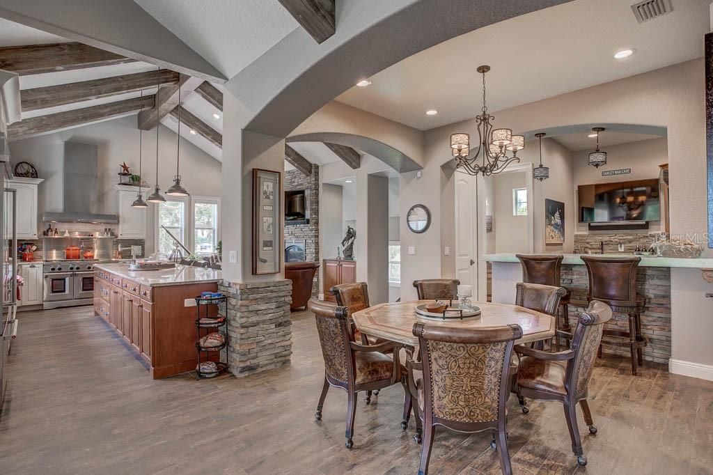 Chandelier, Dining room, Interior, Kitchen, Pendant Lights, Recessed Lighting, Stainless Steel Appliances, Wooden Beams, Wood Texture Flooring