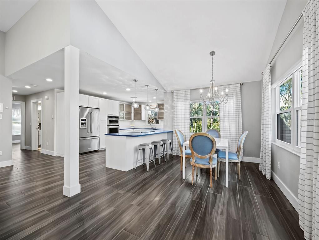Chandelier, Dining room, Interior, Kitchen, Pendant Lights, Recessed Lighting, Stainless Steel Appliances, Wood Texture Flooring