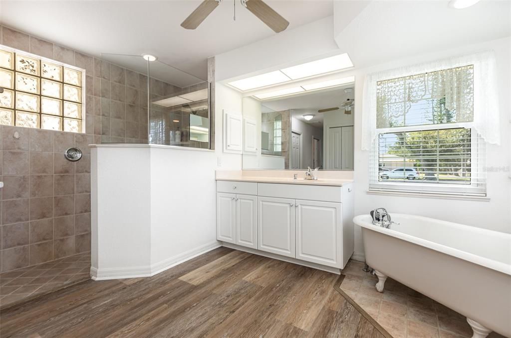 Bathroom, Dual Sink Vanities, Free Standing Baths, Glass Shower, Interior, Recessed Lighting, Wood Texture Flooring