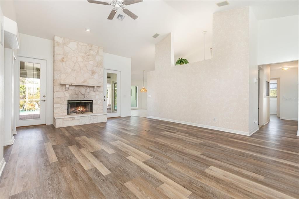 Empty room, Fireplace, Interior, Pendant Lights, Recessed Lighting, Wood Texture Flooring