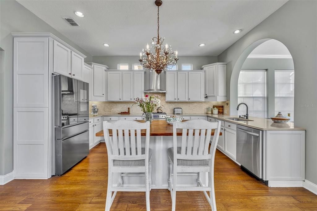 Chandelier, Interior, Kitchen, Pendant Lights, Recessed Lighting, Stainless Steel Appliances, Wood Texture Flooring