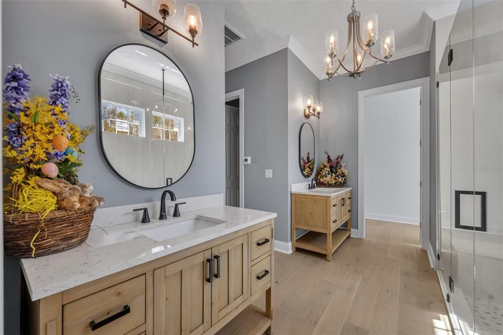 Bathroom, Chandelier, Dual Sink Vanities, Interior, Wood Texture Flooring