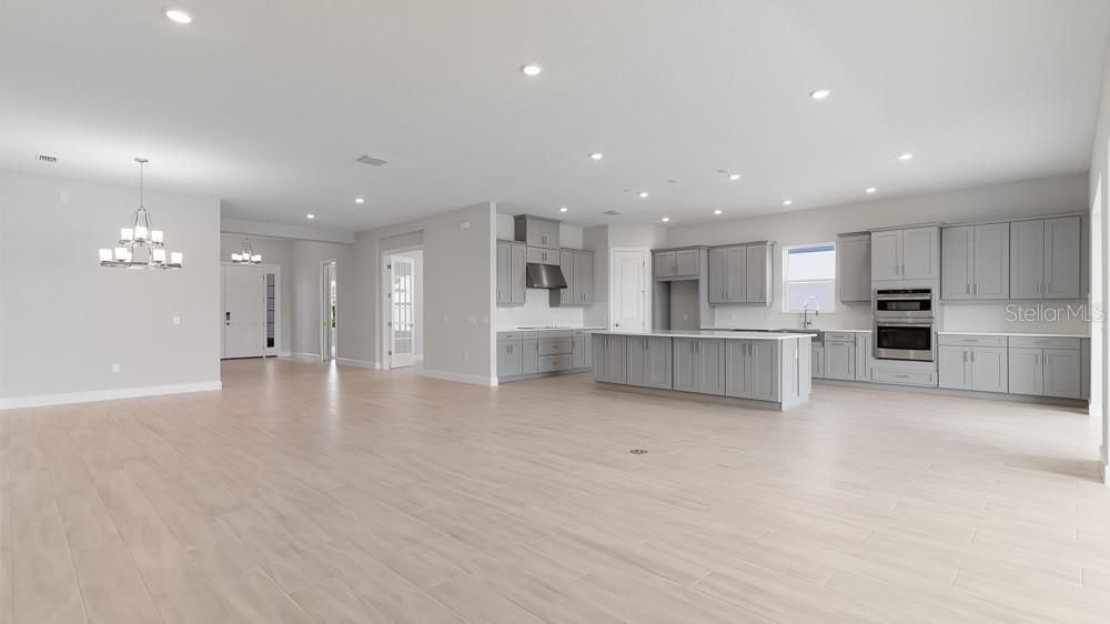 Chandelier, Empty room, Interior, Kitchen, Pendant Lights, Recessed Lighting, Stainless Steel Appliances, Wood Texture Flooring