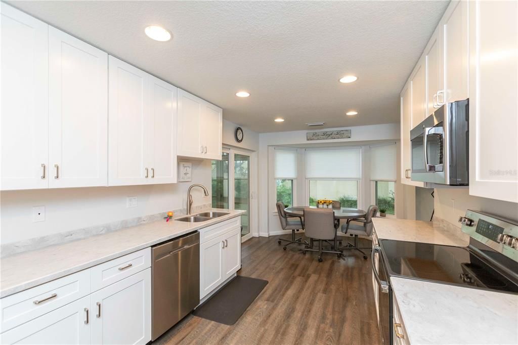 Dining room, Interior, Kitchen, Recessed Lighting, Stainless Steel Appliances, Wood Texture Flooring
