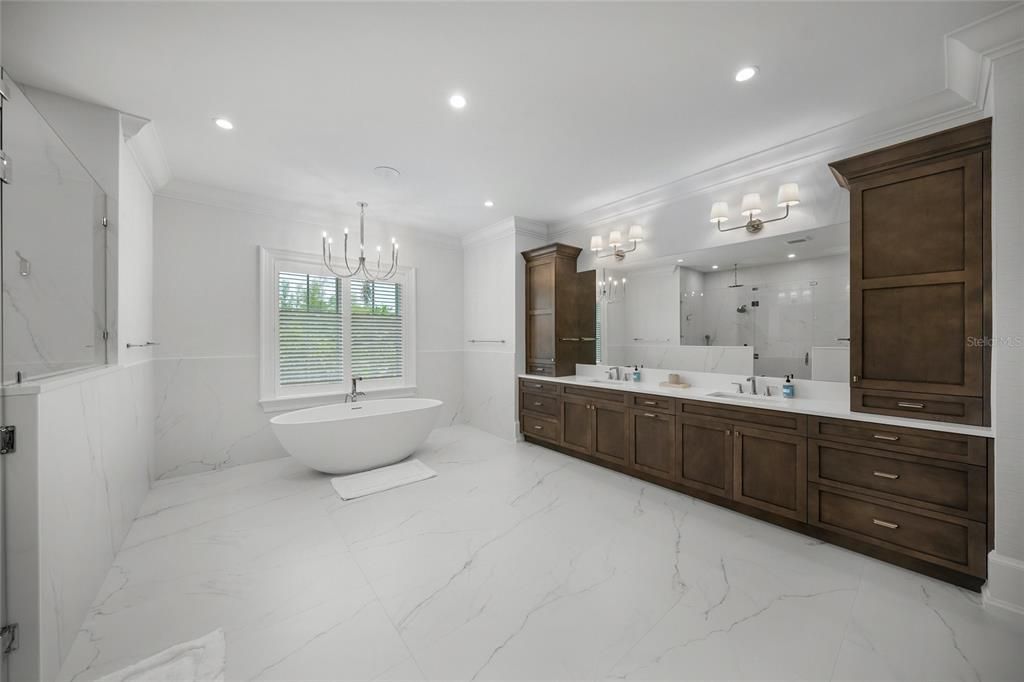 Bathroom, Chandelier, Dual Sink Vanities, Free Standing Baths, Interior, Marble, Marble Walls, Recessed Lighting
