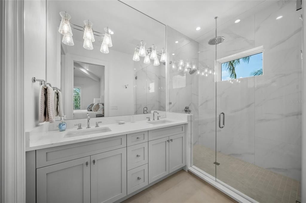 Bathroom, Dual Sink Vanities, Glass Shower, Interior, Marble Walls, Recessed Lighting