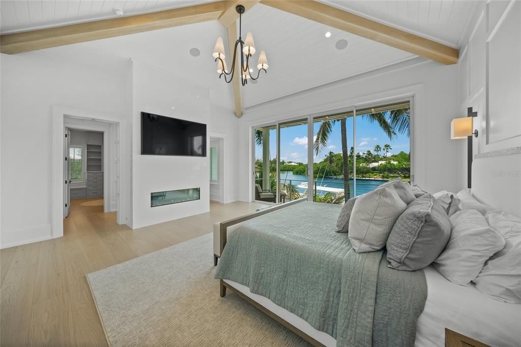 Bedroom, Chandelier, Fireplace, Interior, Recessed Lighting, Water, Wooden Beams, Wood Texture Flooring