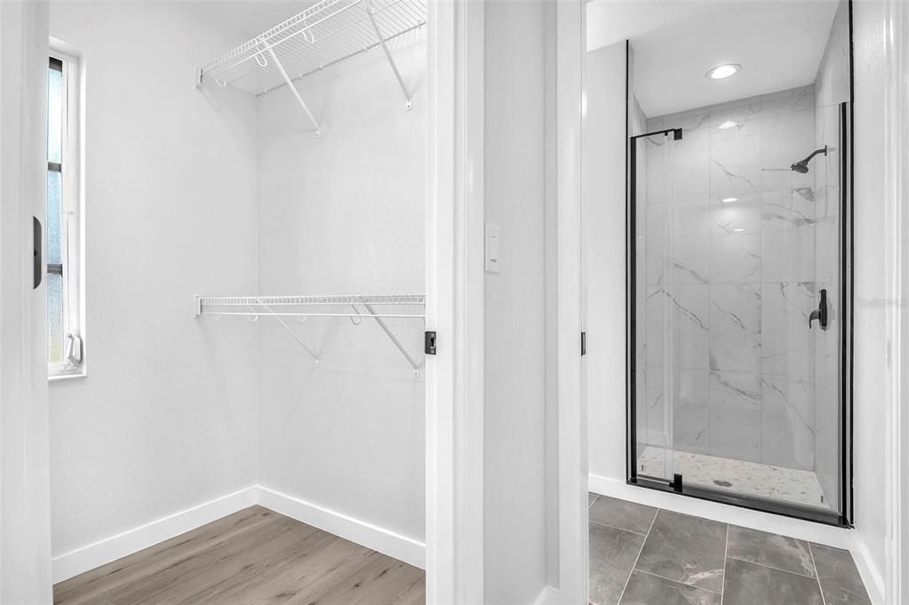 Bathroom, Glass Shower, Interior, Marble Walls, Recessed Lighting, Walk-in Closets, Wood Texture Flooring