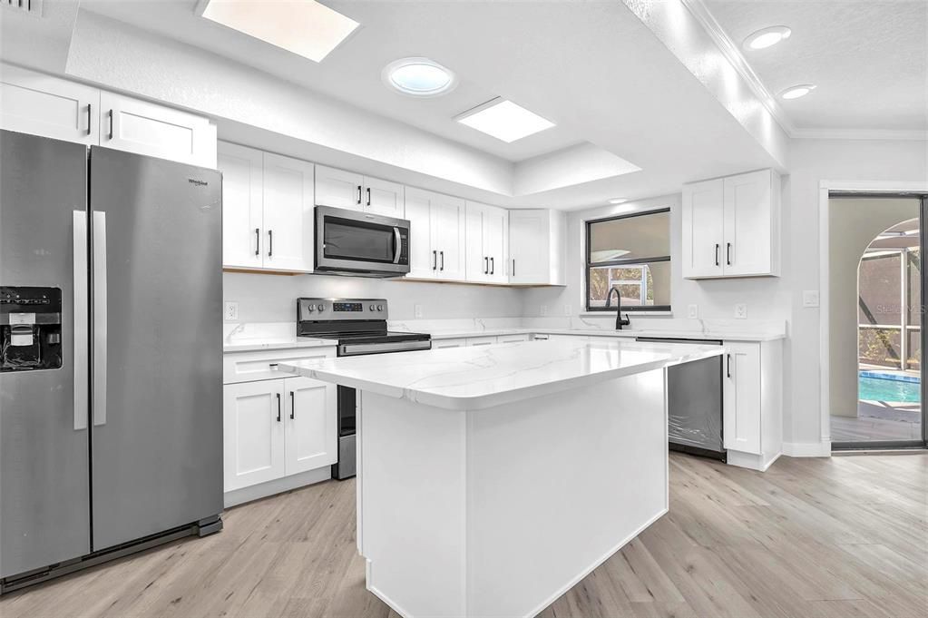 Interior, Kitchen, Recessed Lighting, Stainless Steel Appliances, Wood Texture Flooring
