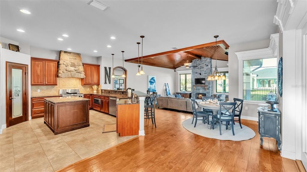 Dining room, Fireplace, Interior, Kitchen, Living room, Pendant Lights, Recessed Lighting, Stainless Steel Appliances, Wooden Ceilings, Wood Texture Flooring