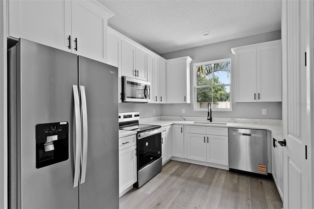 Interior, Kitchen, Recessed Lighting, Stainless Steel Appliances, Wood Texture Flooring