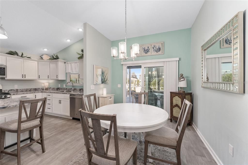 Dining room, Interior, Kitchen, Pendant Lights, Recessed Lighting, Stainless Steel Appliances, Wood Texture Flooring