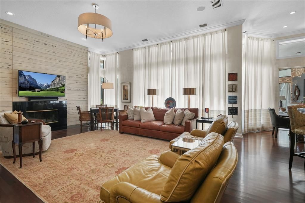 Dining room, Fireplace, Interior, Living room, Pendant Lights, Recessed Lighting, Wood Texture Flooring, Wooden Walls