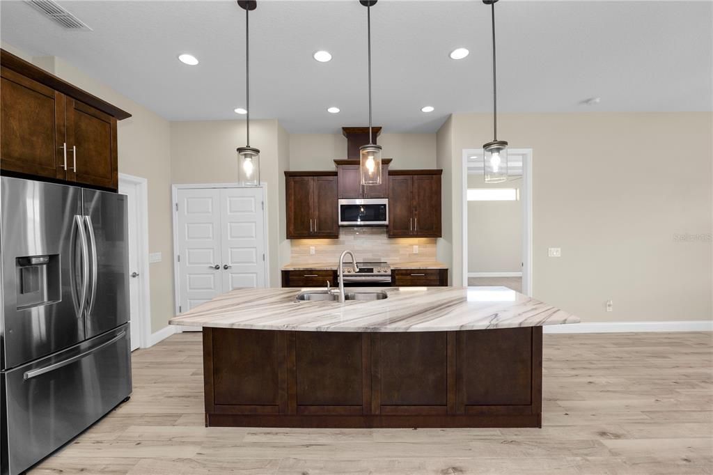 Interior, Kitchen, Pendant Lights, Recessed Lighting, Stainless Steel Appliances, Wood Texture Flooring