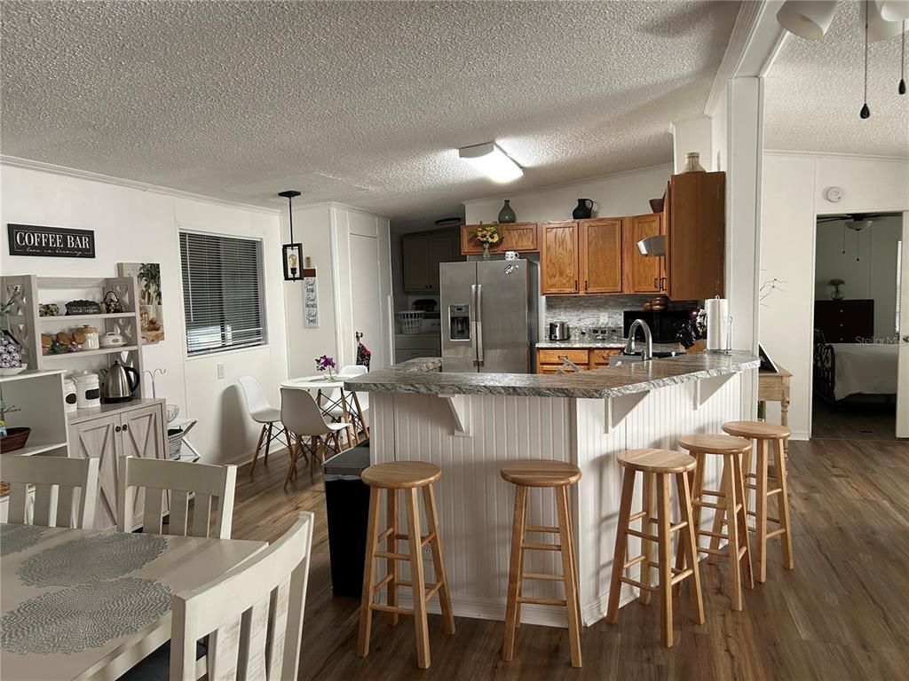Dining room, Interior, Kitchen, Pendant Lights, Stainless Steel Appliances, Wood Texture Flooring
