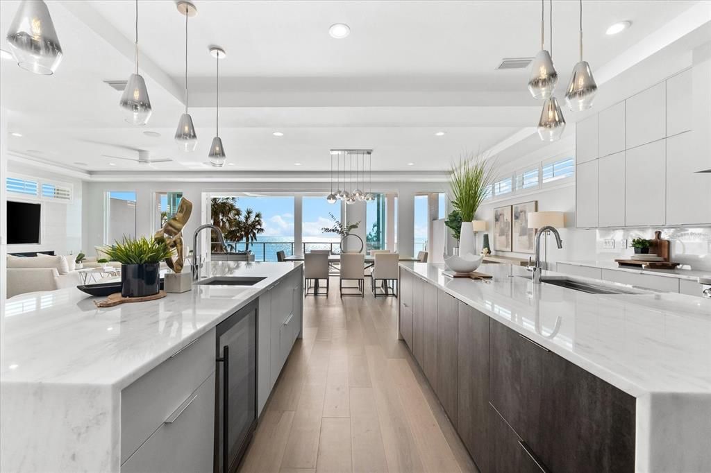 Dining room, Interior, Kitchen, Living room, Pendant Lights, Recessed Lighting, Stainless Steel Appliances, Water, Wood Texture Flooring