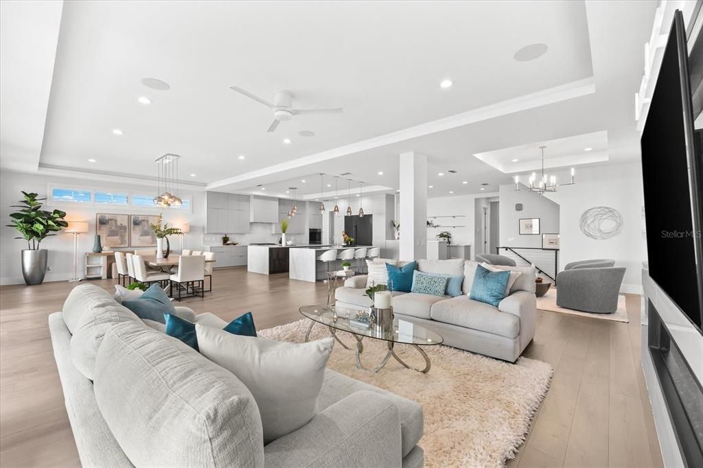 Chandelier, Dining room, Interior, Kitchen, Living room, Pendant Lights, Recessed Lighting, Stainless Steel Appliances, Wood Texture Flooring